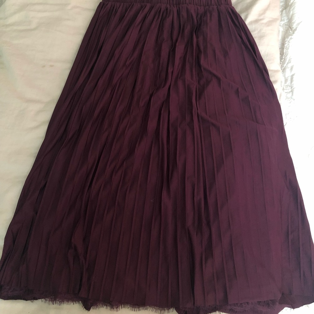Purple pleated skirt with lace detail